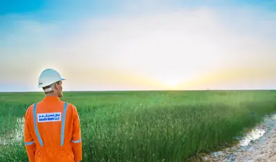 An employee of Bauer Resources at constructed wetland for wastewater treatment at nimr oman.